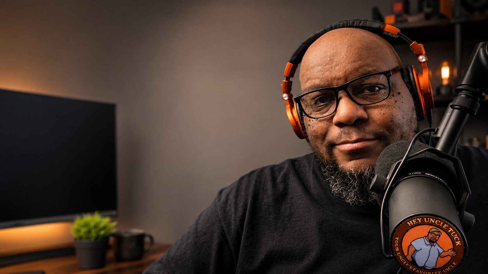 Uncle Tuck in a warm studio setting, introducing the Hey Uncle Tuck welcome video.