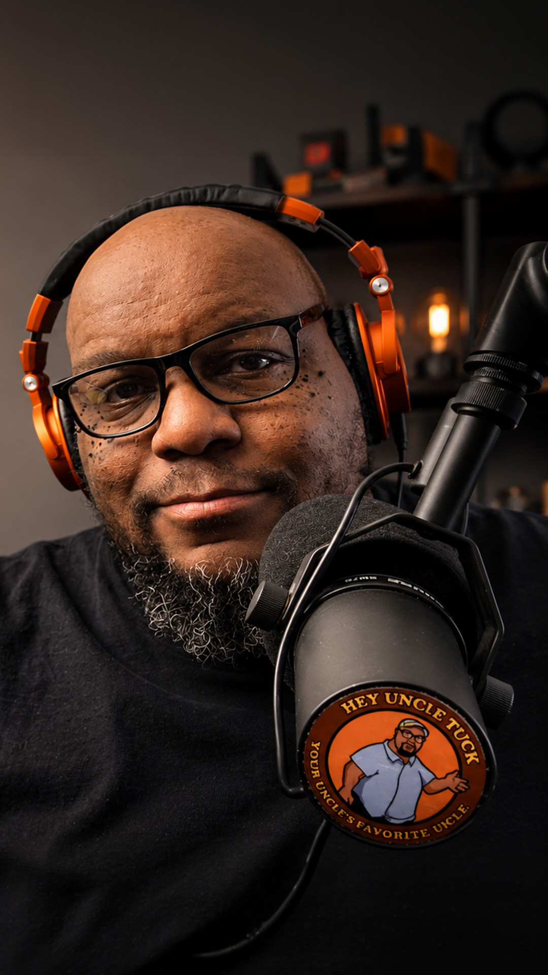Tucker speaking into a studio microphone.